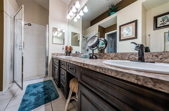 9636 Brookdale Dr, New Port Richey, FL 34655 - full bathroom featuring double vanity, a sink, tile patterned floors, and a shower stall