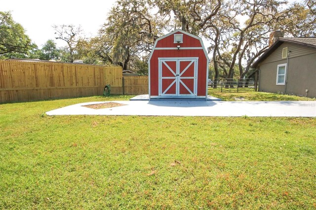 view of shed with fence