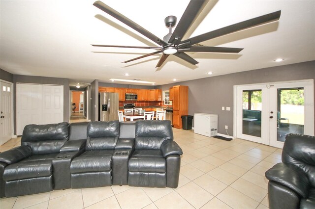 living room with light tile patterned flooring, ceiling fan, french doors, and recessed lighting