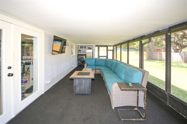 unfurnished sunroom featuring outdoor lounge area