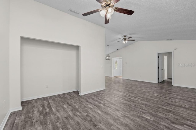 unfurnished living room featuring visible vents, dark wood-type flooring, a textured ceiling, a ceiling fan, and vaulted ceiling