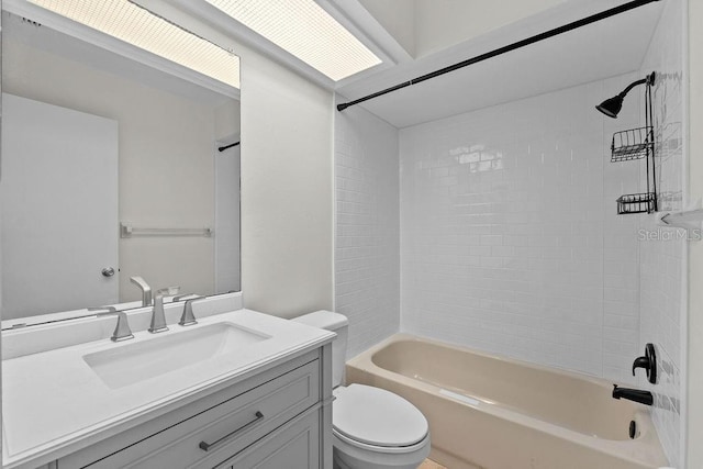 bathroom featuring bathing tub / shower combination, vanity, and toilet