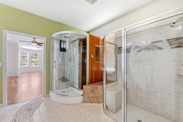 full bathroom with tile patterned floors, visible vents, a shower stall, and ceiling fan