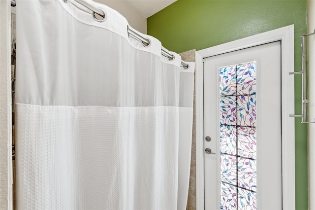 full bath with a shower with curtain