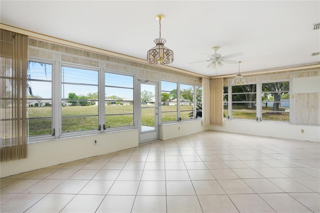 unfurnished sunroom featuring visible vents