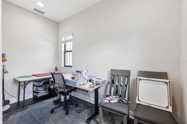 office space featuring visible vents, wood finished floors, and baseboards