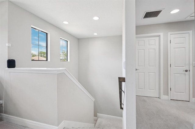 stairs featuring recessed lighting, baseboards, visible vents, and carpet