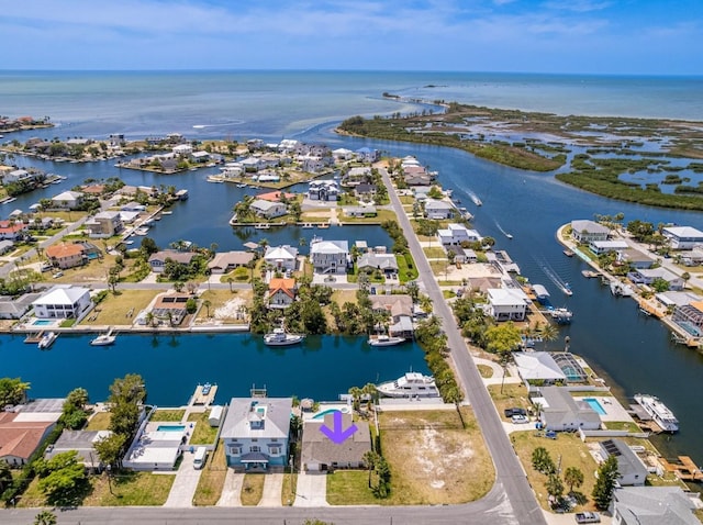 aerial perspective of suburban area featuring a nearby body of water