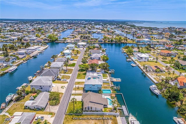 aerial perspective of suburban area with a large body of water