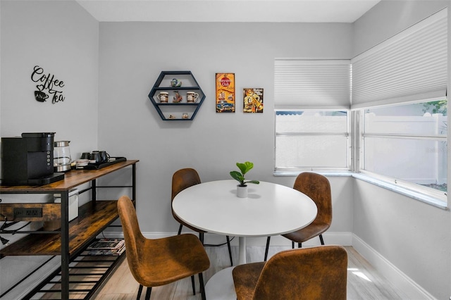 dining room featuring baseboards