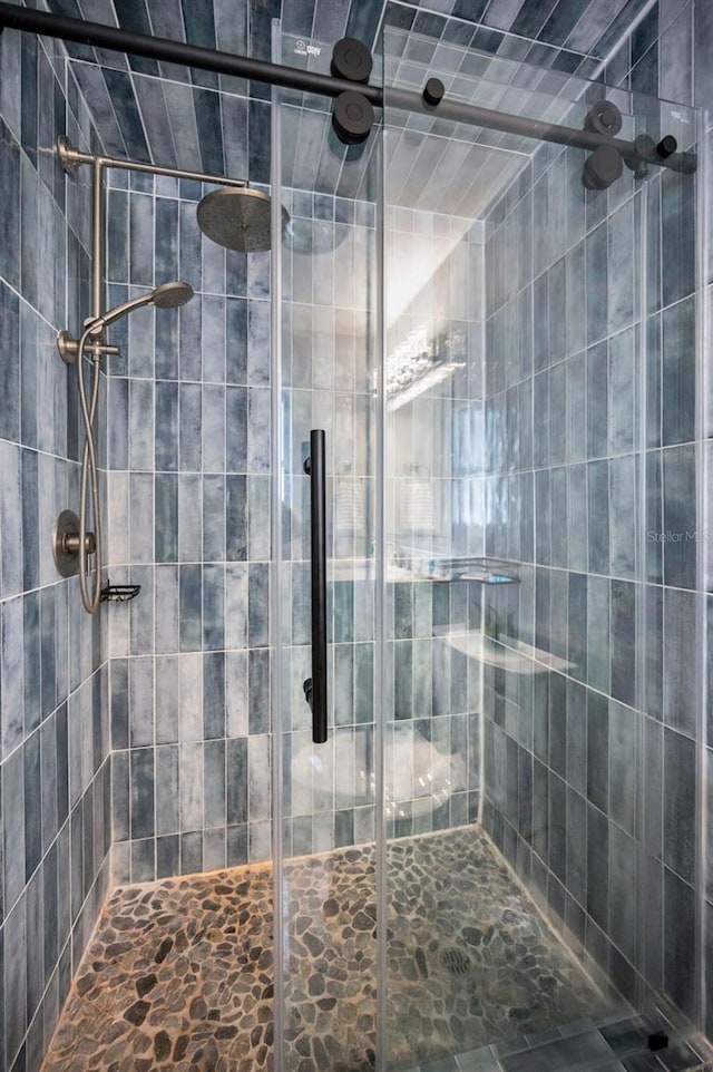 bathroom with a shower stall
