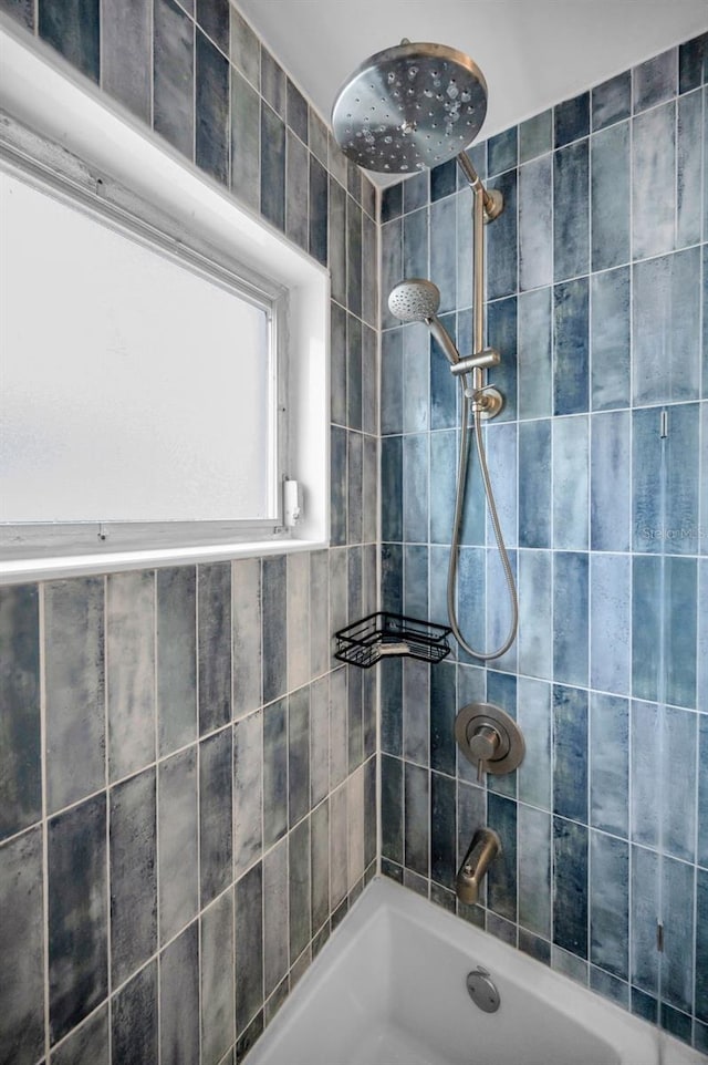 bathroom with bathing tub / shower combination