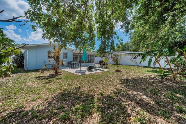 view of yard with a patio and a fenced backyard