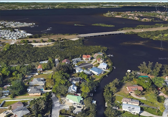 drone / aerial view featuring a water view and a residential view