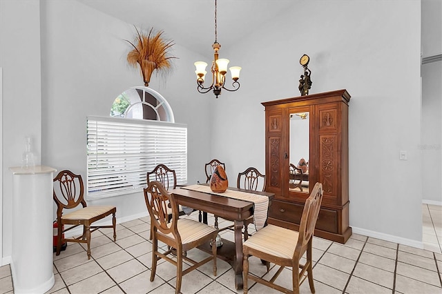 dining space with baseboards, a notable chandelier, a high ceiling, and light tile patterned floors