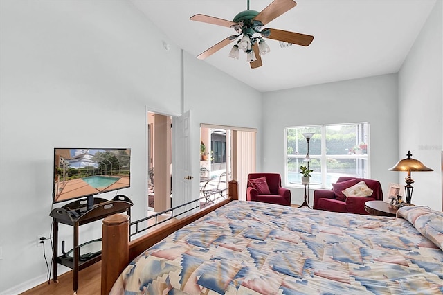 bedroom with baseboards, high vaulted ceiling, ceiling fan, and wood finished floors