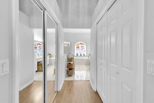 corridor with light wood-style flooring