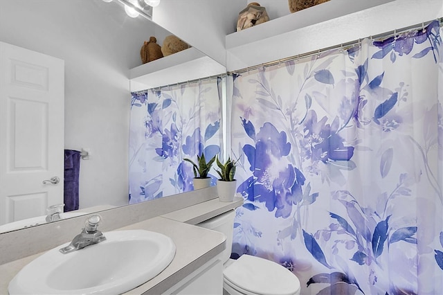 full bathroom featuring shower / bath combination with curtain, toilet, and vanity