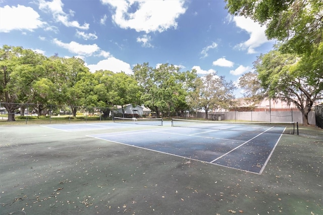 view of tennis court with fence