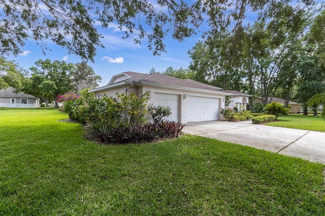 view of home's exterior featuring concrete driveway, stucco siding, a yard, and an attached garage