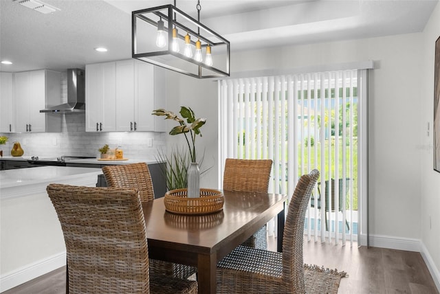 3416 Lema Dr, Spring Hill, FL 34609 - dining room with wood finished floors, a textured ceiling, baseboards, visible vents, and recessed lighting