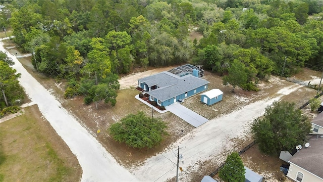 view from above of property with a forest