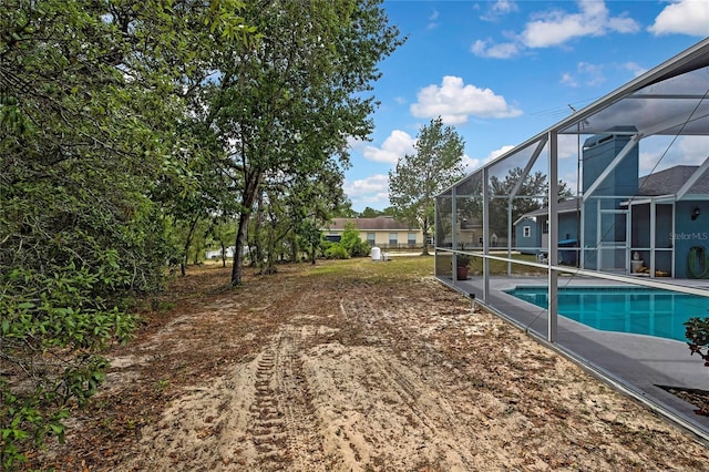swimming pool featuring glass enclosure