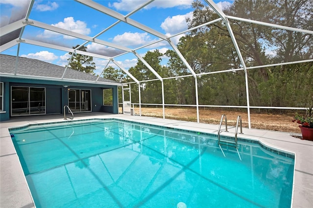 swimming pool featuring a patio area and a lanai