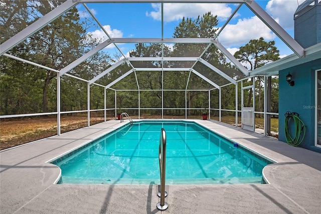 outdoor pool with a patio and a lanai