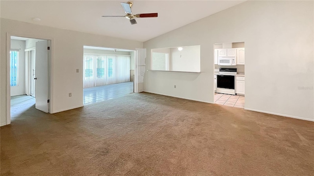 unfurnished living room featuring a ceiling fan, high vaulted ceiling, baseboards, and light colored carpet