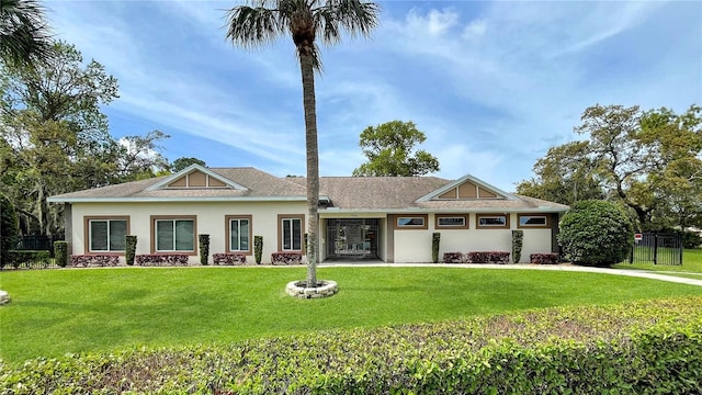 craftsman-style house with a front yard and stucco siding