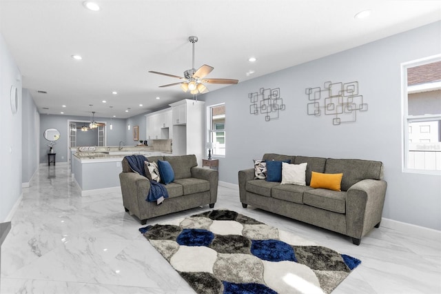 living room featuring marble finish floor, baseboards, ceiling fan, and recessed lighting