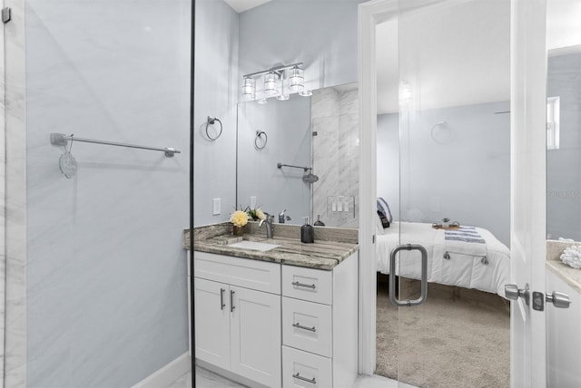 bathroom featuring ensuite bath and vanity