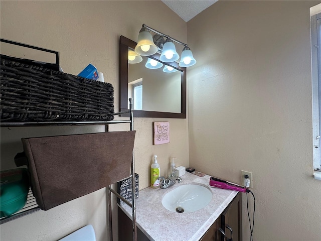 bathroom with vanity and lofted ceiling