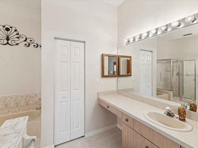 bathroom with a stall shower, a closet, and a bath