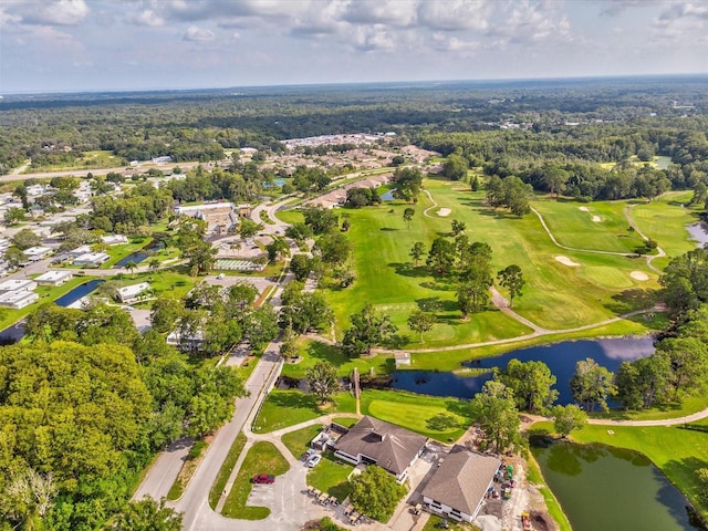 aerial view with golf course view and a water view
