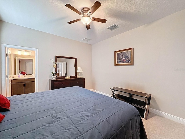 bedroom featuring carpet flooring, a textured ceiling, visible vents, baseboards, and a ceiling fan