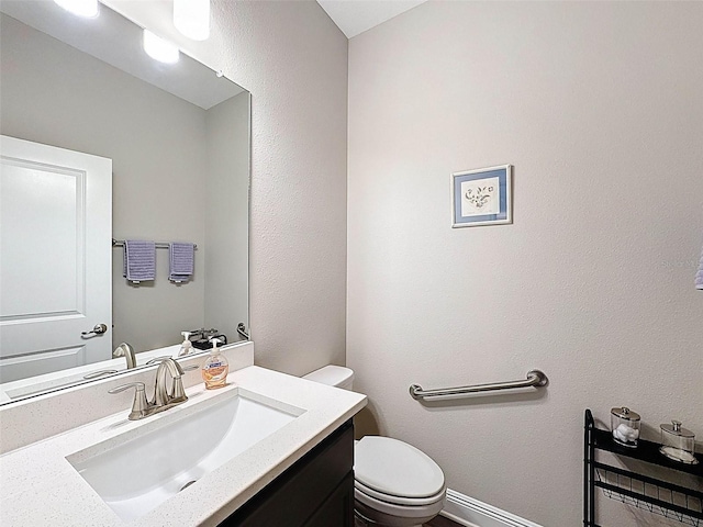 half bath with toilet and vanity