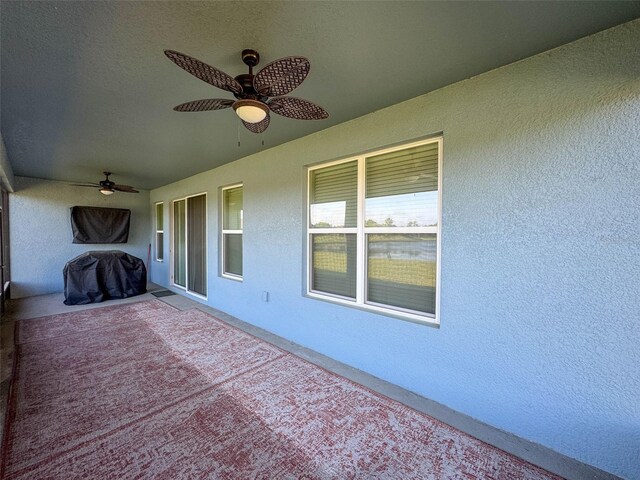 view of patio featuring ceiling fan