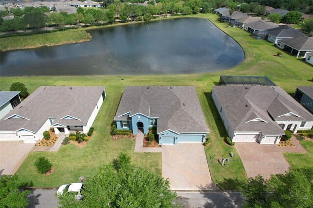 birds eye view of property with a residential view and a water view
