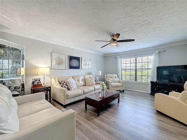 7382 SE Concord Pl, Hobe Sound, FL 33455 - living room featuring a textured ceiling, ceiling fan, ornamental molding, and wood finished floors