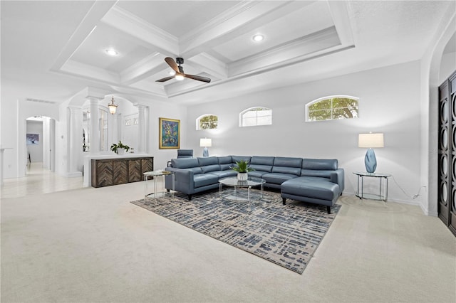 living room with ornate columns, beam ceiling, arched walkways, carpet floors, and coffered ceiling
