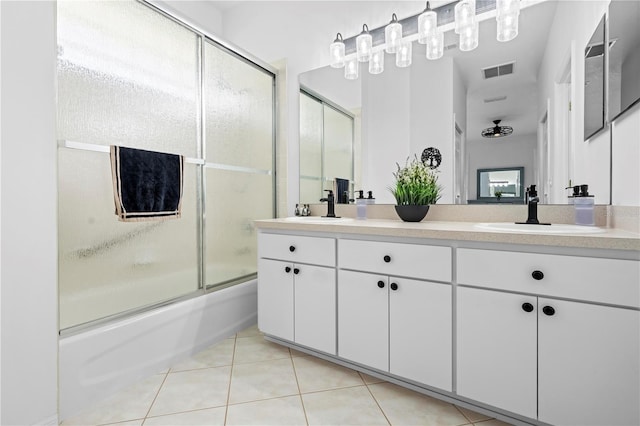 full bathroom with tile patterned floors, a sink, enclosed tub / shower combo, and visible vents