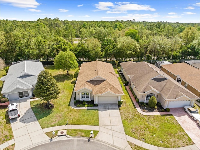 aerial view featuring a wooded view