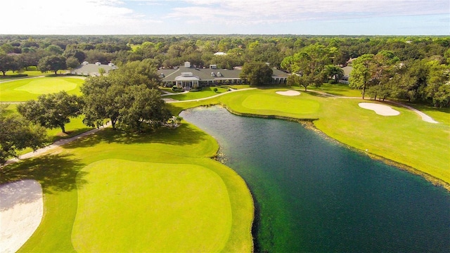aerial view with view of golf course and a water view