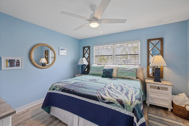 4400 Floramar Ter, New Port Richey, FL 34652 - bedroom featuring baseboards, ceiling fan, and wood finished floors