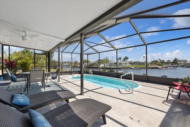 4400 Floramar Ter, New Port Richey, FL 34652 - pool featuring a lanai, a patio, ceiling fan, and a water view