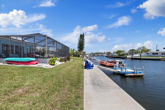 4400 Floramar Ter, New Port Richey, FL 34652 - dock area with a water view, a yard, and a lanai