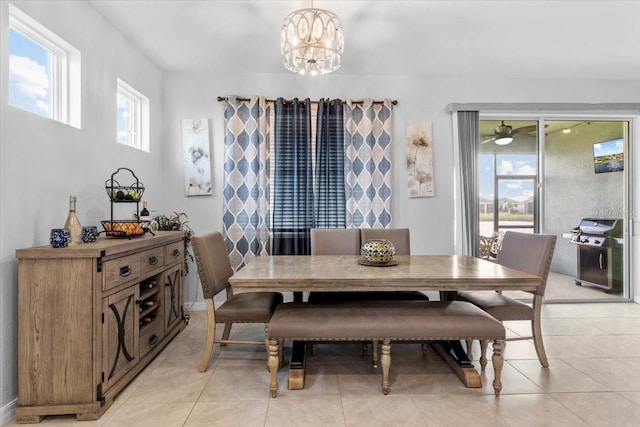 13338 Waterleaf Garden Cir, Riverview, FL 33579 - dining room featuring light tile patterned flooring and a chandelier