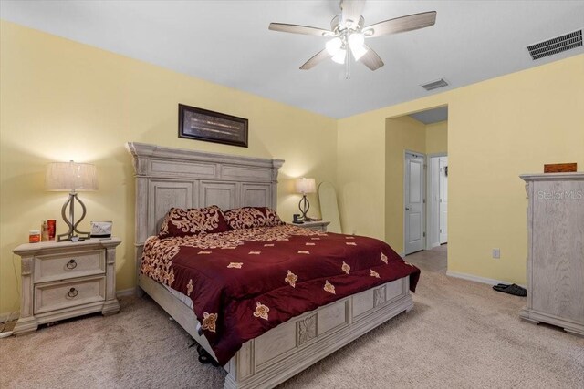 13338 Waterleaf Garden Cir, Riverview, FL 33579 - bedroom with light carpet, baseboards, and ceiling fan